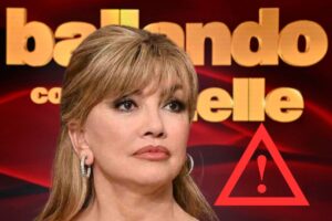 milly carlucci logo ballando e simbolo pericolo